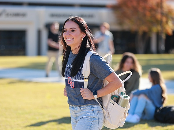 Student walking across campus.