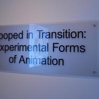 Placard for the exhibit called "Looped in Transition: Experimental Forms of Animation" 