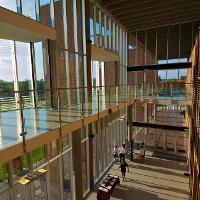 Looking over an indoor balcony, rays of sun on the left side 