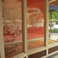 A storefront looking towards the street 