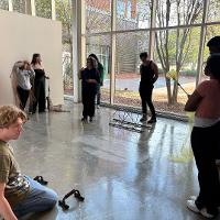 Katya working with group of students