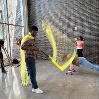 Group of students participating in an exhibit