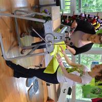 Two female students working on a piece of fabric 