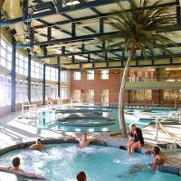 several people in an indoor hot tub 