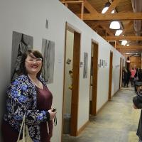 Two students laughing in a hallway 