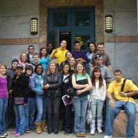 Students posing at the entrance to a building 