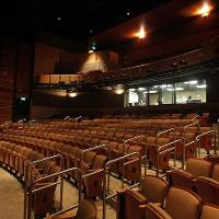 Empty performing arts theater with cushioned seating
