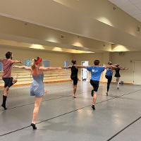 group of dance students practicing in practice room