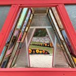 Sculpture of stained glass in the shape of a 3 dimensional triangle