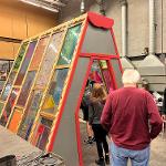 Sculpture of stained glass in the shape of a 3 dimensional triangle