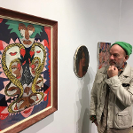 Michael Stipe looking at an abstract painting