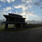 Pasaquan pagoda building silhouetted at sunrise with misty morning light