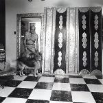 Eddie Owens Martin inside his home with his German Shepherd