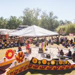 Aerial view of musicians performing in the painted sand circle amphitheater at a Pasaquan concert