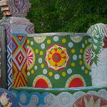 Freshly restored painted concrete wall at Pasaquan with vibrant colors