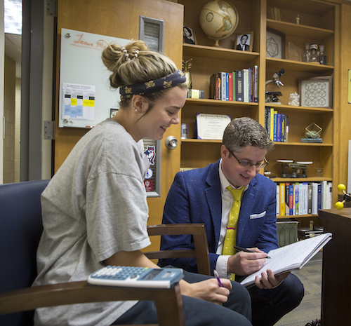 A student getting help from a faculty member