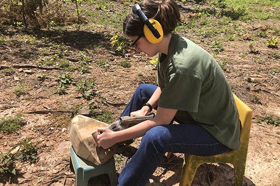 a student working with tools