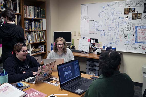multiple students in an office