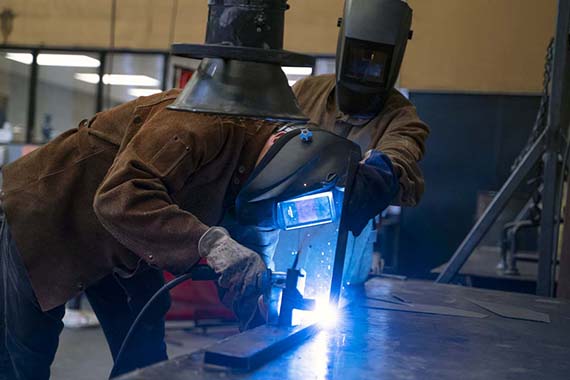 two people welding
