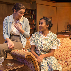 two female students sitting and talking to each other
