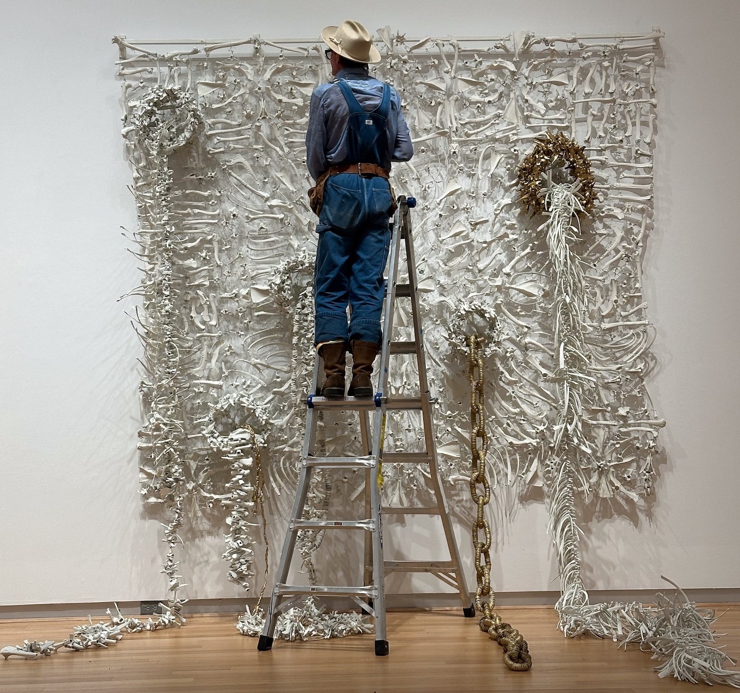 Butch Anthony creating his wall of bones