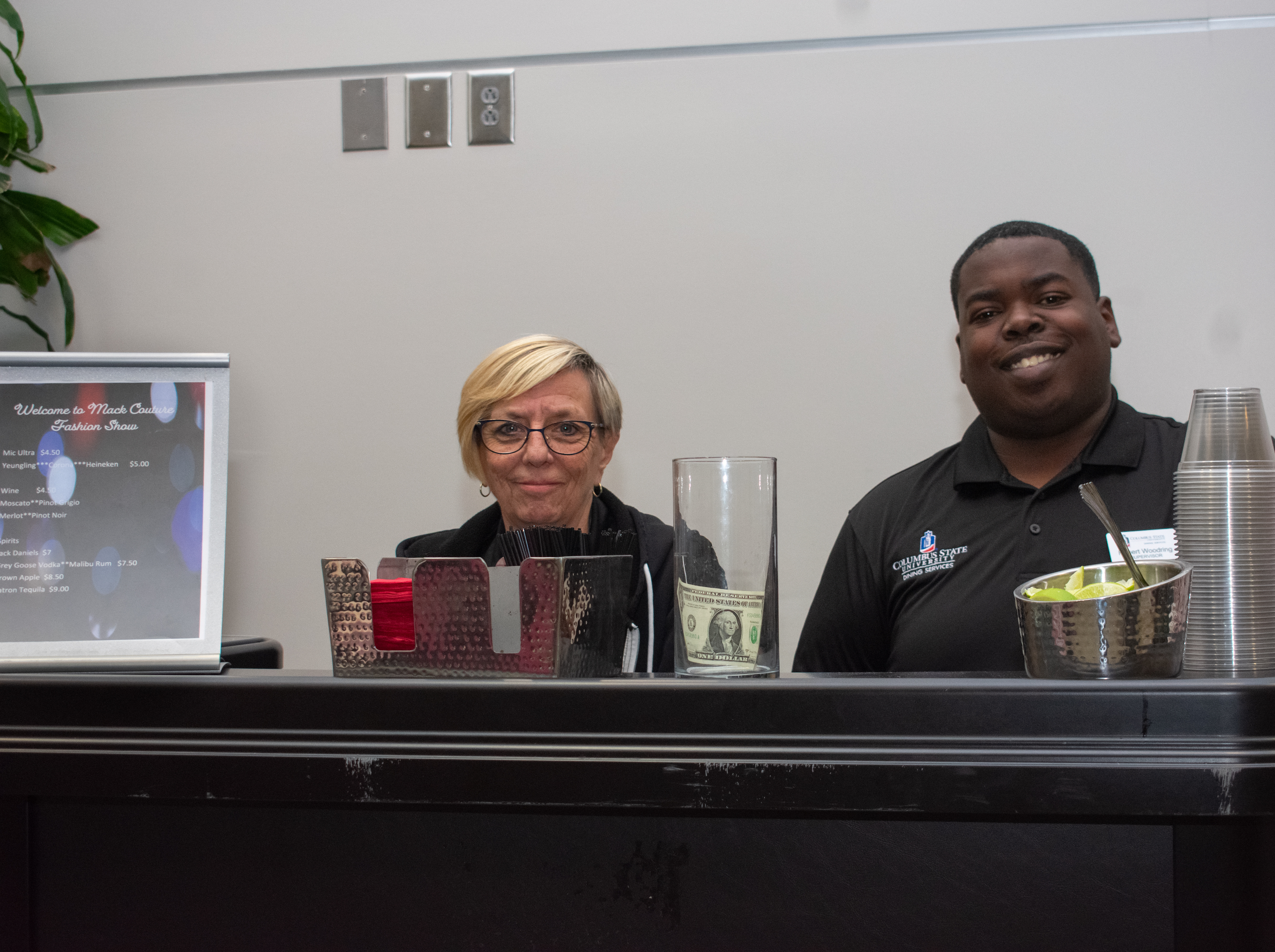 Bartenders behind a bar
