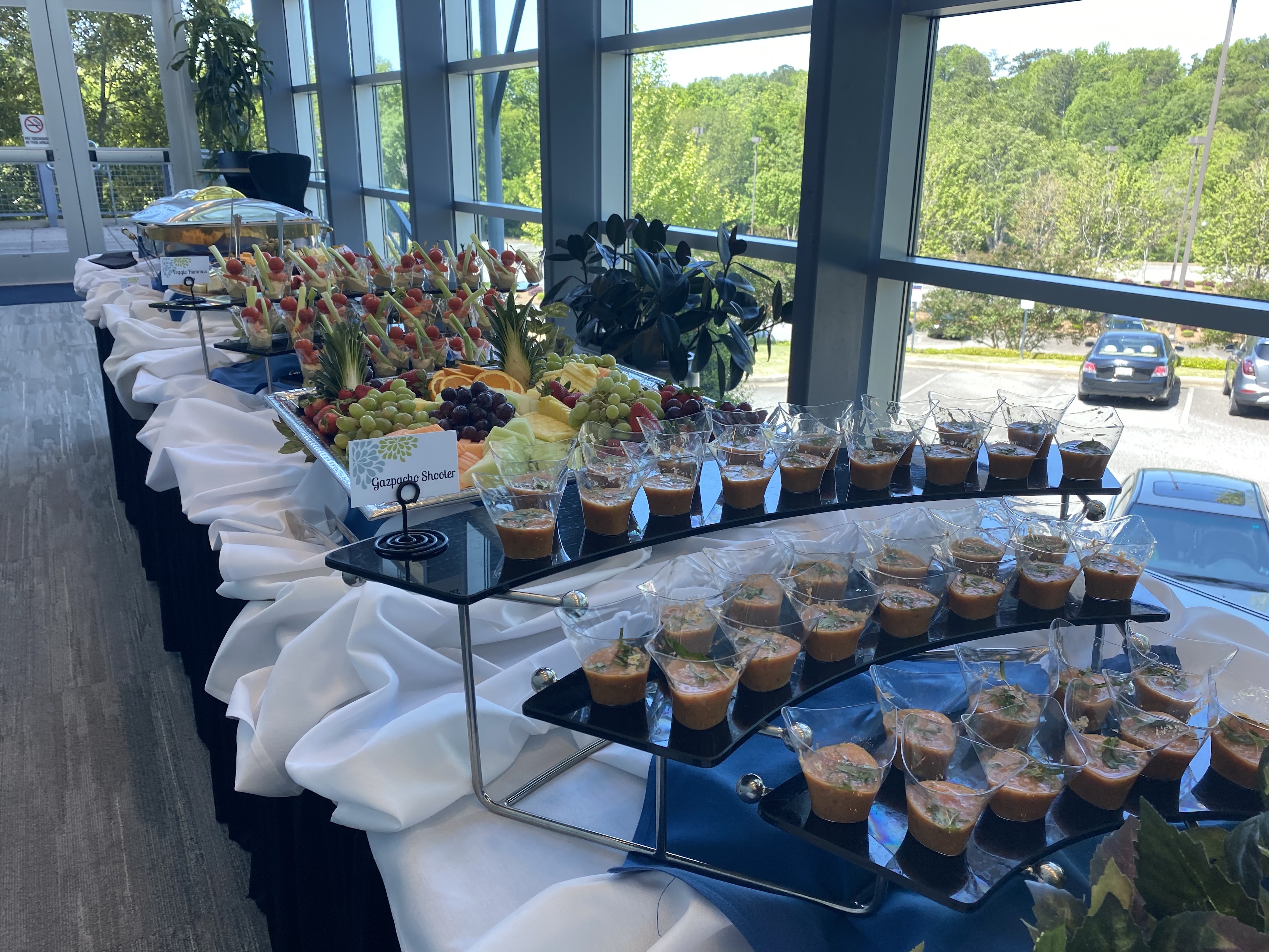 Table with cups of fruit and vegetables
