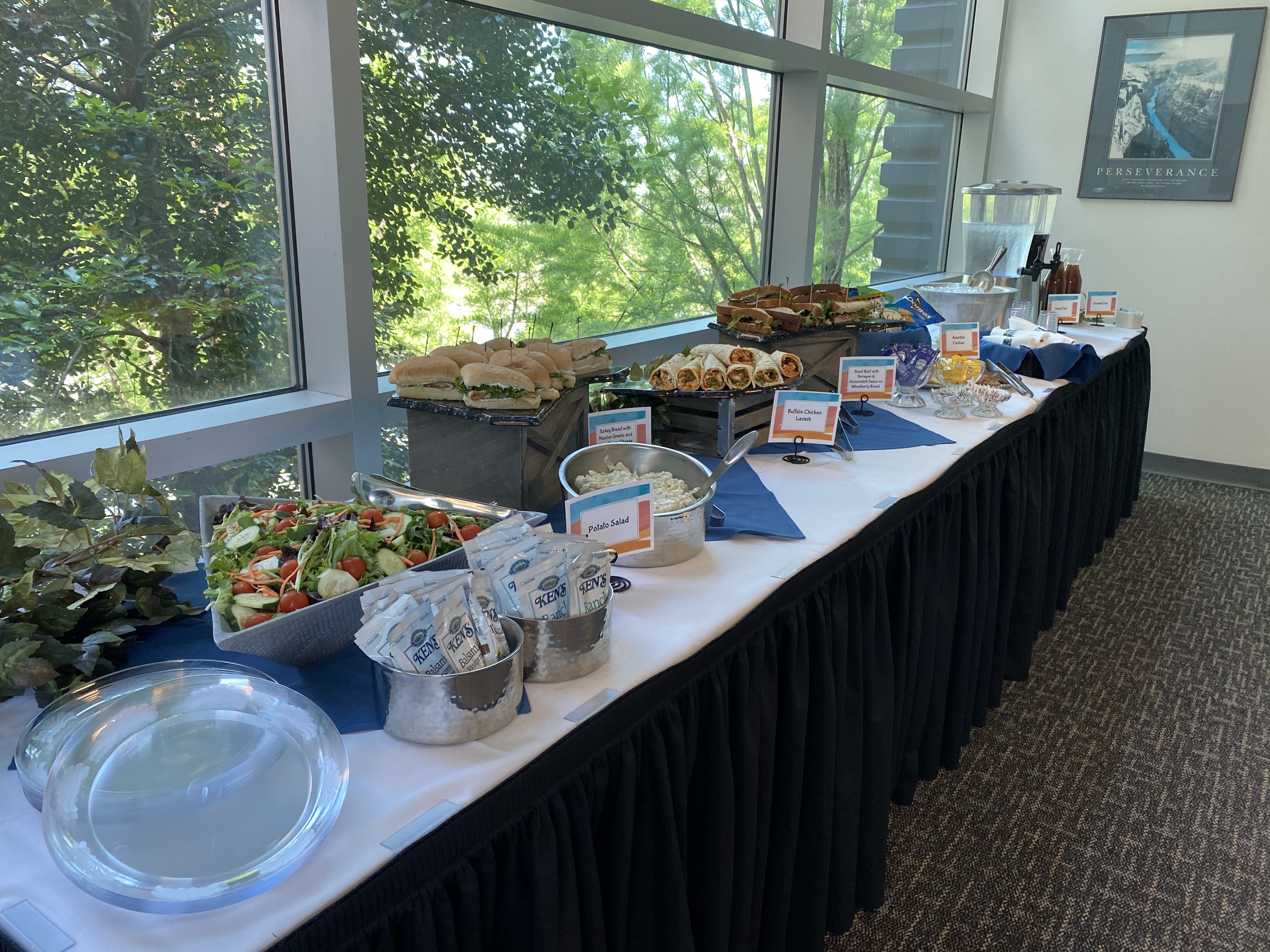 Table with salad and sandwiches