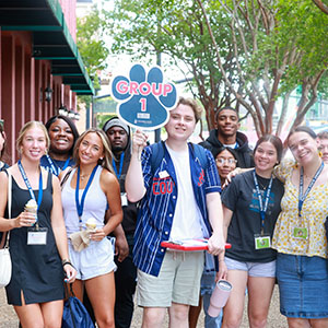 Students posing together outdoors during ROAR Orientation
