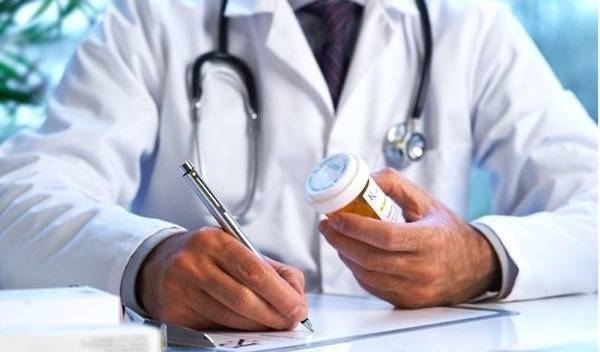 Doctor holding a prescription bottle