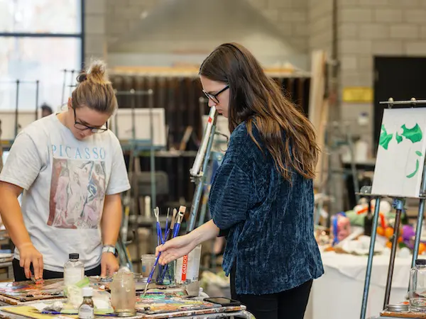 Students in an art class painting