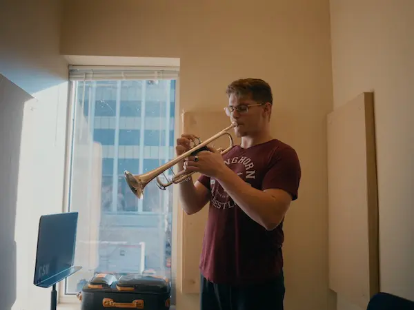 A music student playing the trumpet