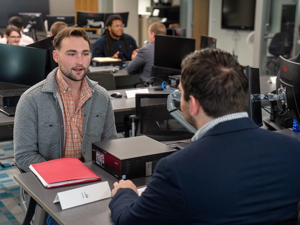Classroom of student paired up talking to each other