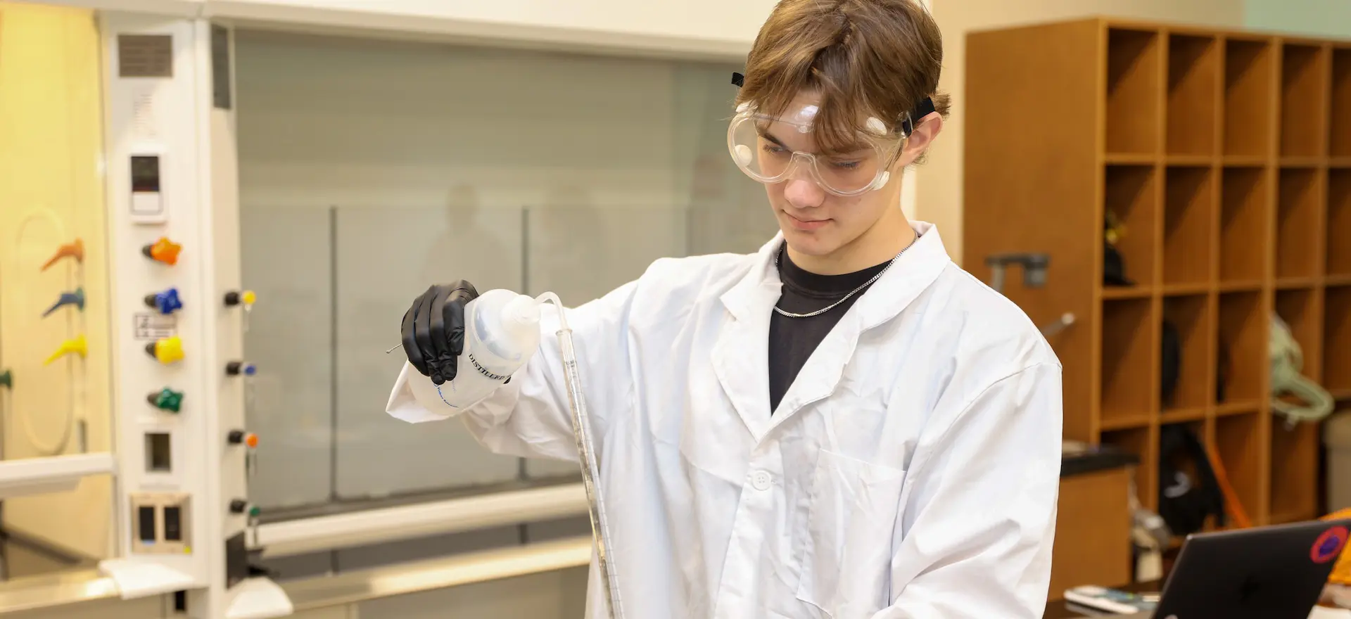chemistry student doing an experiment