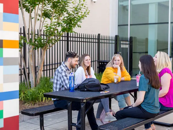 Students hanging out on RiverPark campus