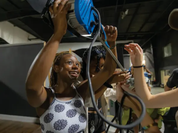 students working with film equipment