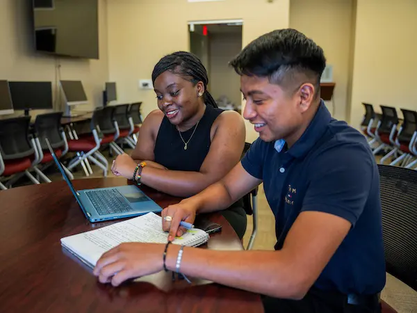 two students studying together