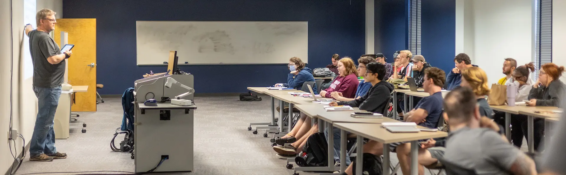 A professor teaching to his class