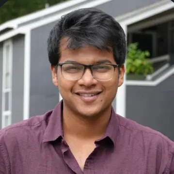 a headshot photo of Yogesh Botcha