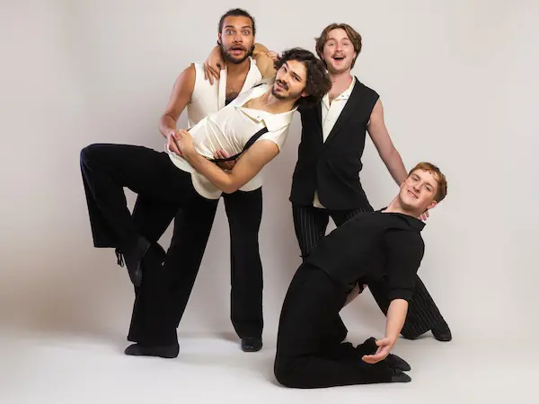 four male dance students in a silly pose