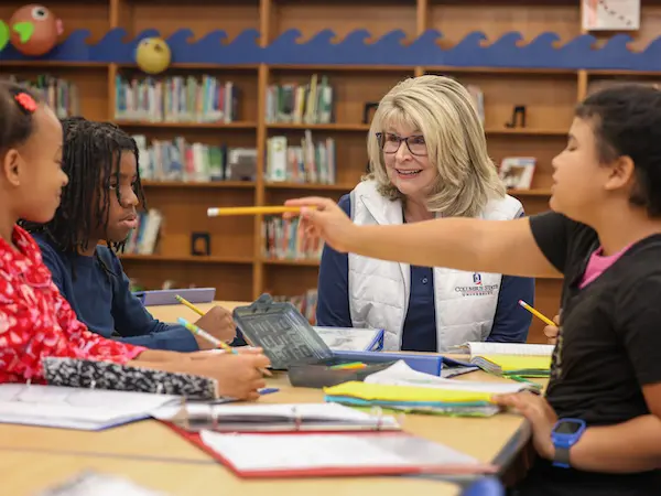 Dr. Yates with elementary students