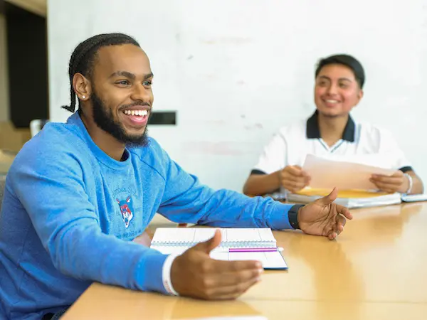 two students sitting at a table