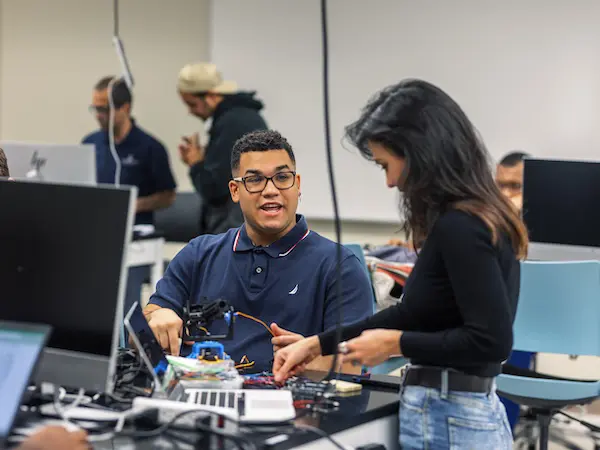 students working on electrical gadgets