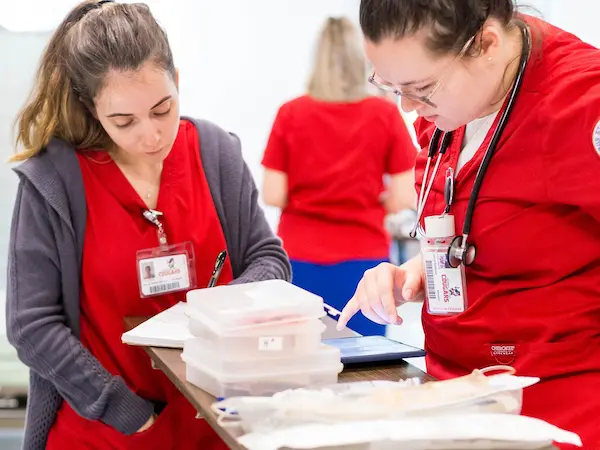 two female nursing students training at a hospital