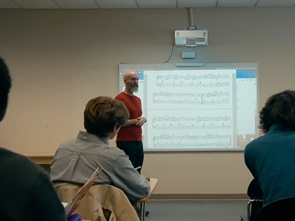 A professor giving a lecture on music theory