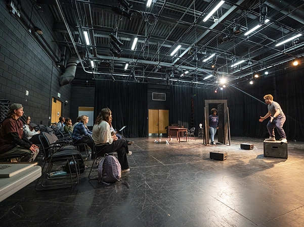 A group of students practicing and perfecting their performance.