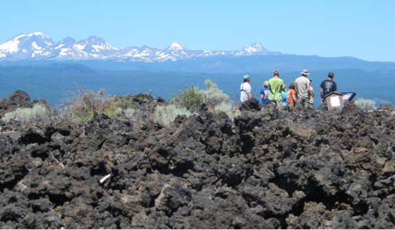 Several students standing on a cliff