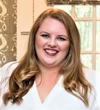 Taylor Mack photo, female with long hair smiling