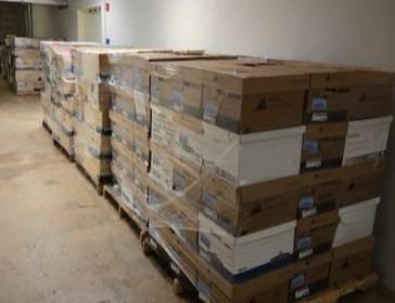Pallets of donated military history papers and artifacts