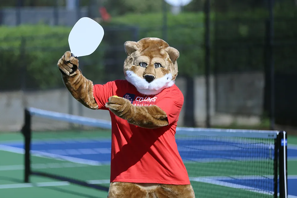Cody posing and playing pickleball